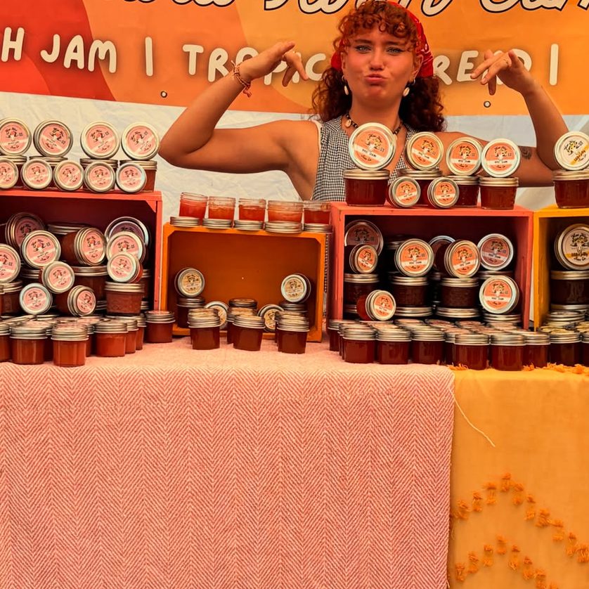 The Maui Nord Farm Company banner above shelves of jars