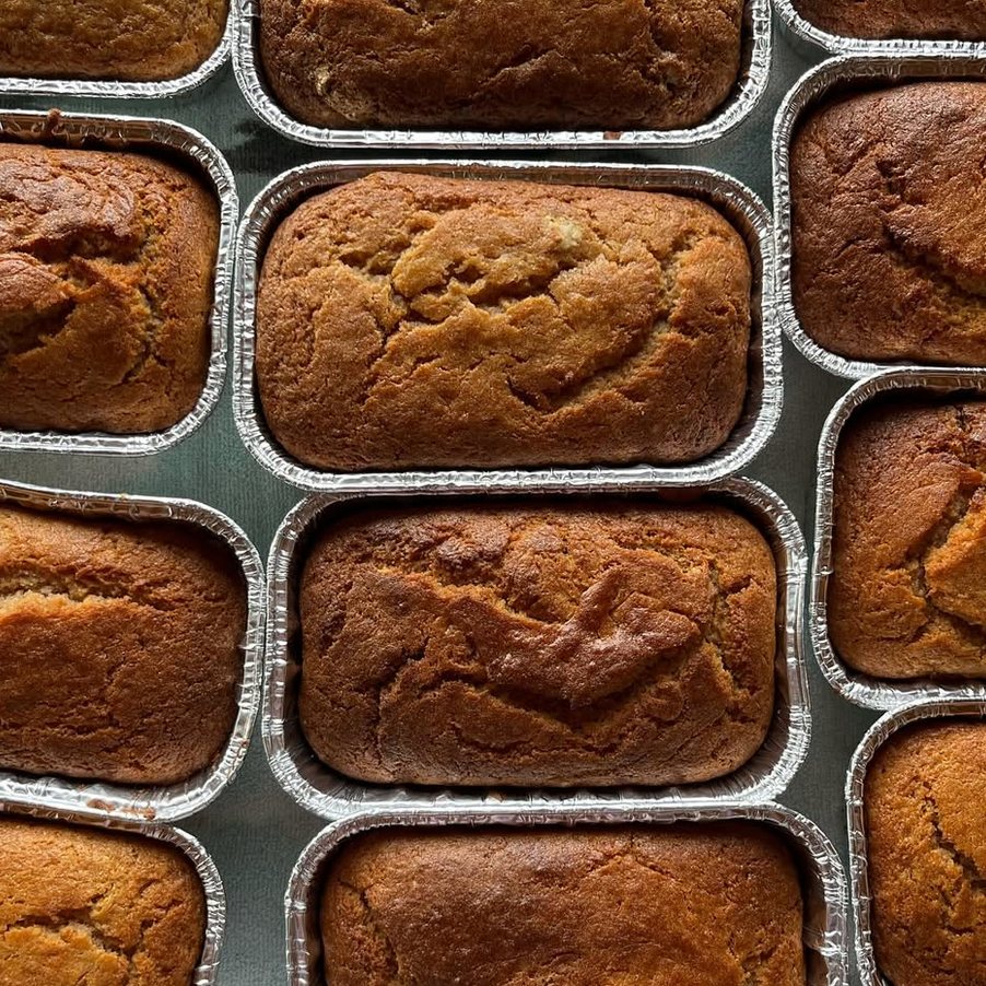 Loaves of bread in foil pans, seen from above