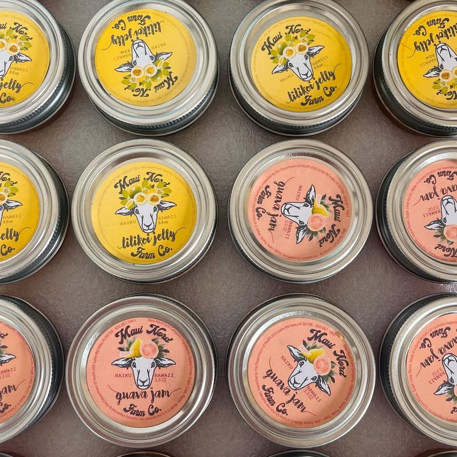 Rows of jar lids, lilikoi jelly and guava jam, seen from above