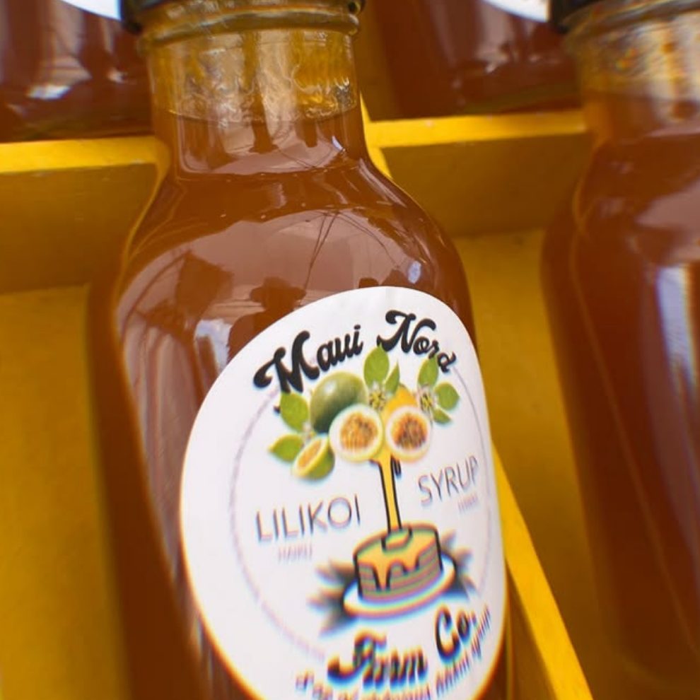 Bottles of lilikoi syrup on a shelf